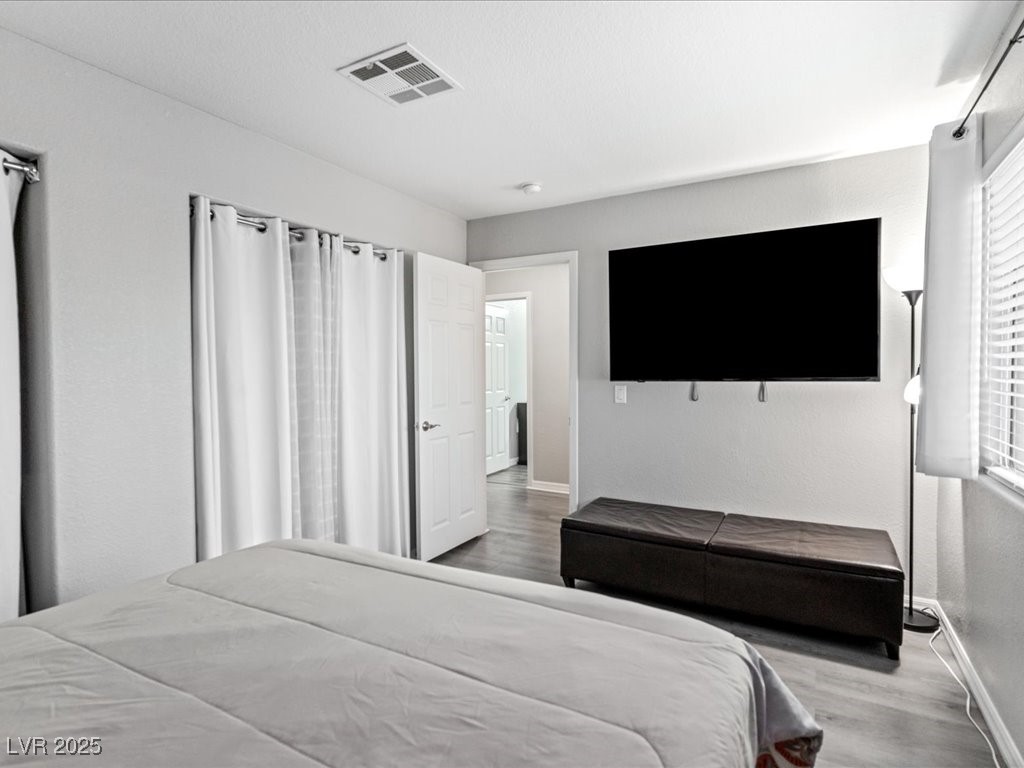 5505 Big Sky Lane Las Vegas, NV 89149 - Photo 28 of 42 Bedroom with visible vents, baseboards, and wood finished floors