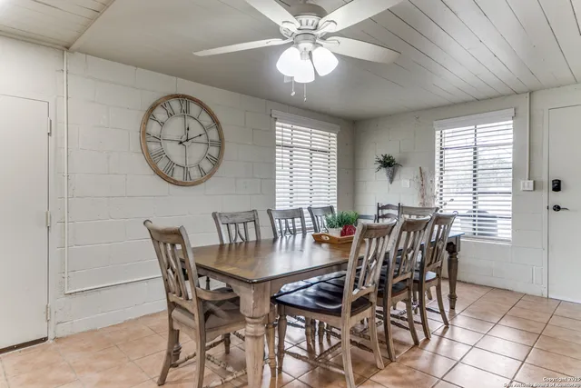 a view of a dining room with furniture and window