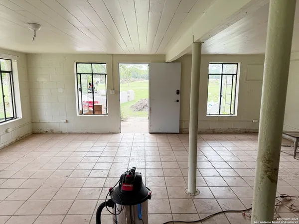 a kitchen with stainless steel appliances kitchen island granite countertop a sink and cabinets