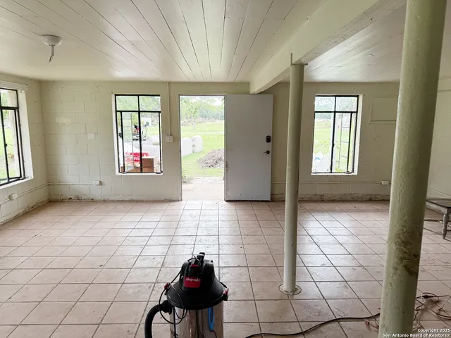 a kitchen with stainless steel appliances kitchen island granite countertop a sink and cabinets