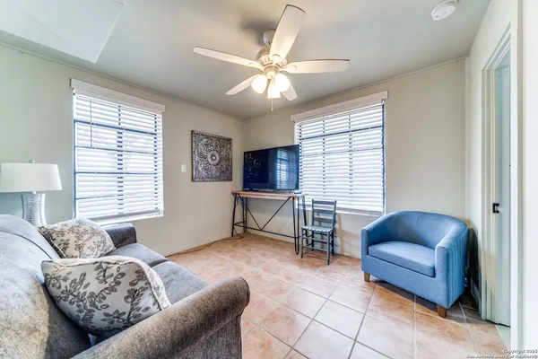 a view of a bathroom with a tub shower and a sink