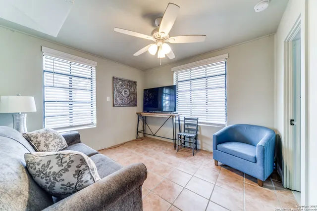 a view of a bathroom with a tub shower and a sink