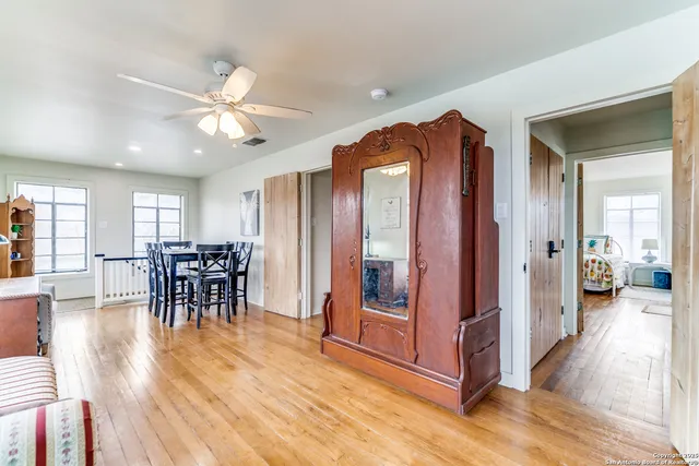 a bedroom with bed couch and window