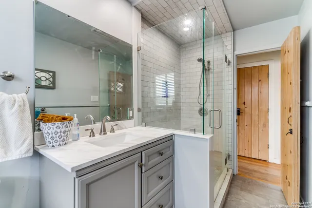 a bedroom with furniture and windows