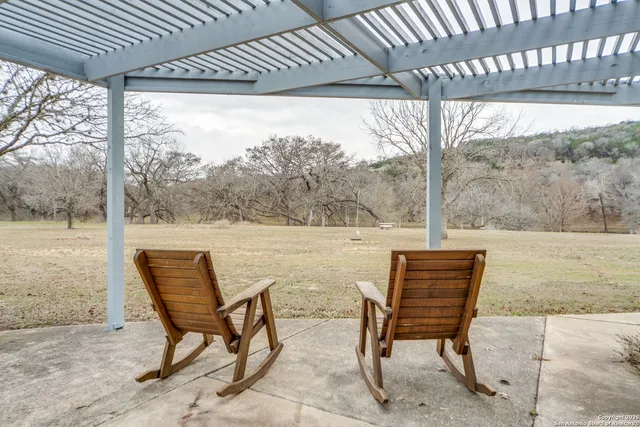 a view of lake and tree in the background