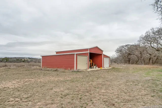a view of backyard with green space