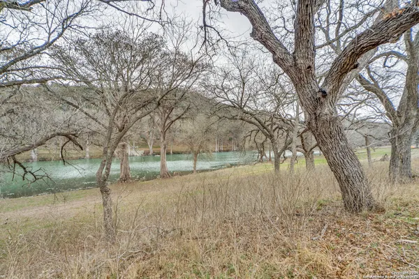 a view of a lake with a bench and a bench
