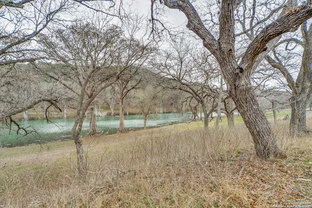 a view of a lake with a bench and a bench
