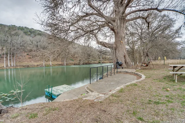 a view of a lake with beach and mountain view