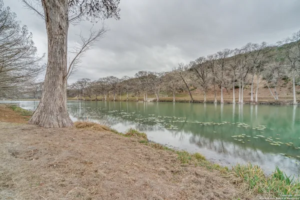 a view of a house with a yard patio and outdoor seating