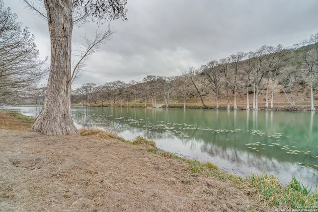 a view of a house with a yard patio and outdoor seating
