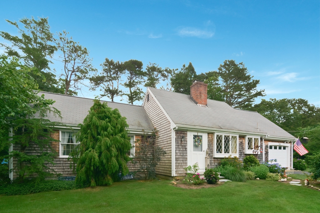 a aerial view of a house with a yard