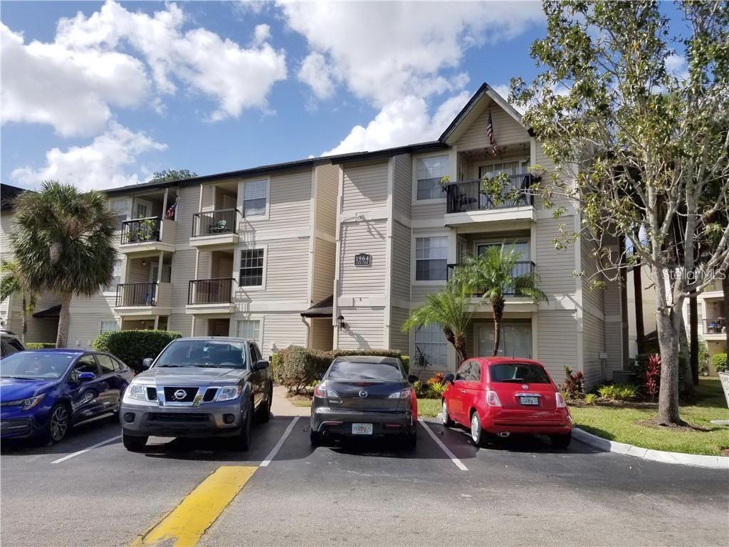 1908 Lake Atriums Circle, Unit 2 Orlando, FL 32839 - Photo 1 of 1 a car parked in front of a house