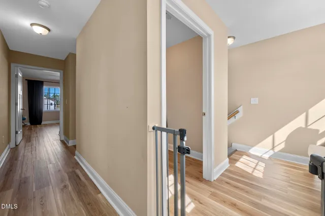 a living room with furniture and a entryway