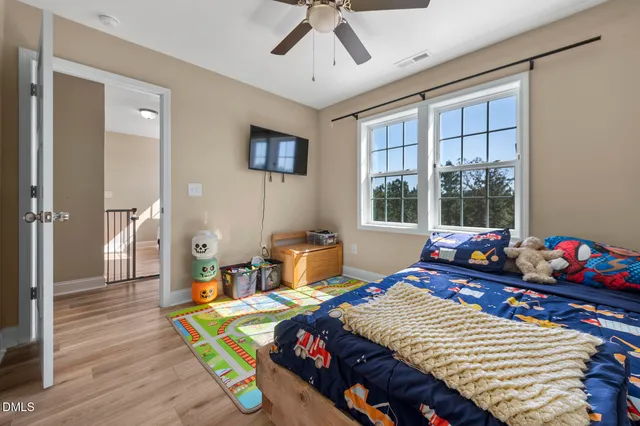 a view of hallway with wooden floor