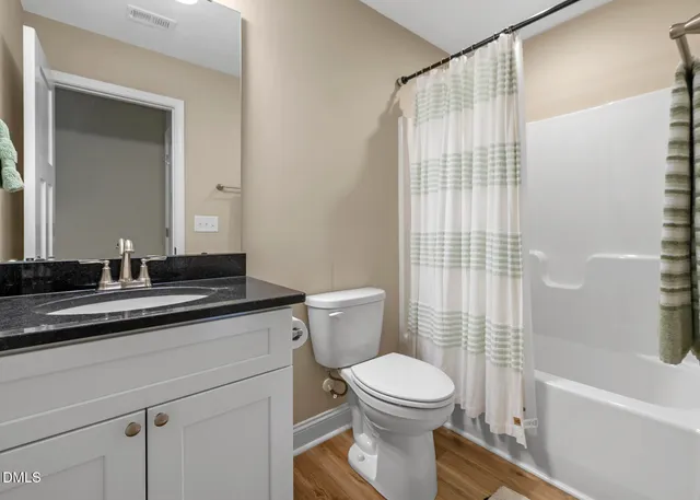 a bedroom that has a bed and a table in it