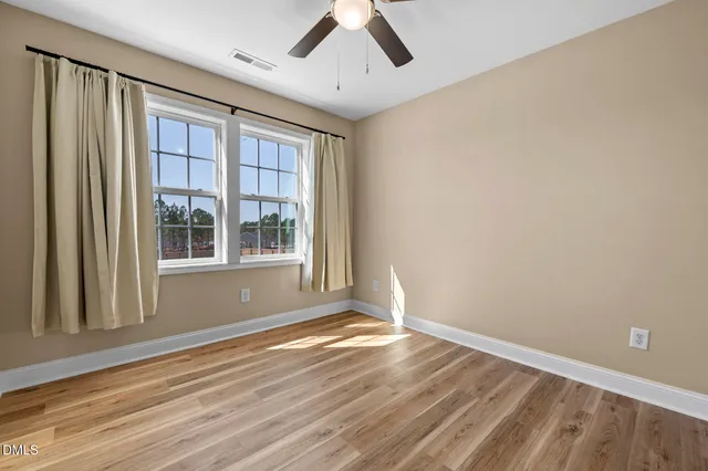 a bedroom with bed and a window
