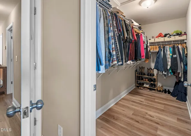 a view of a livingroom with furniture and wooden floor