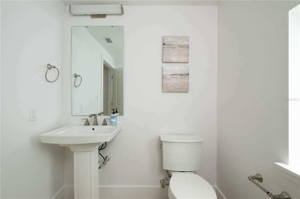 2611 Southwest Williston Road, Unit 3 Gainesville, FL 32608 - Photo 49 of 56 a bathroom with a sink toilet and a mirror