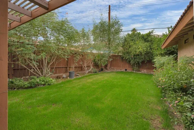 a backyard of a house with lots of green space