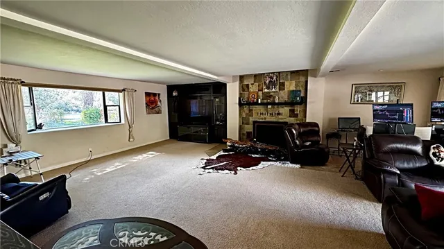 a bedroom with furniture window and flat screen tv