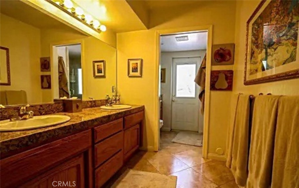 132 Rio Del Loma Kernville, CA 93238 - Photo 13 of 33 a spacious bathroom with a mirror a sink and a shower