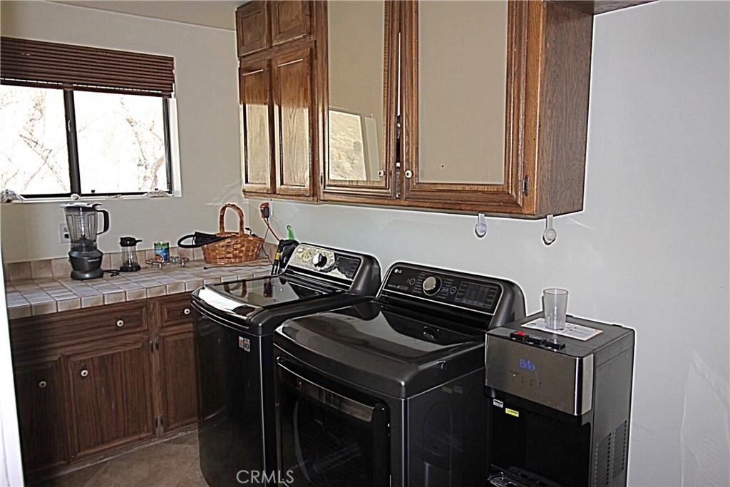 132 Rio Del Loma Kernville, CA 93238 - Photo 20 of 33 a kitchen with granite countertop a sink stove and cabinets