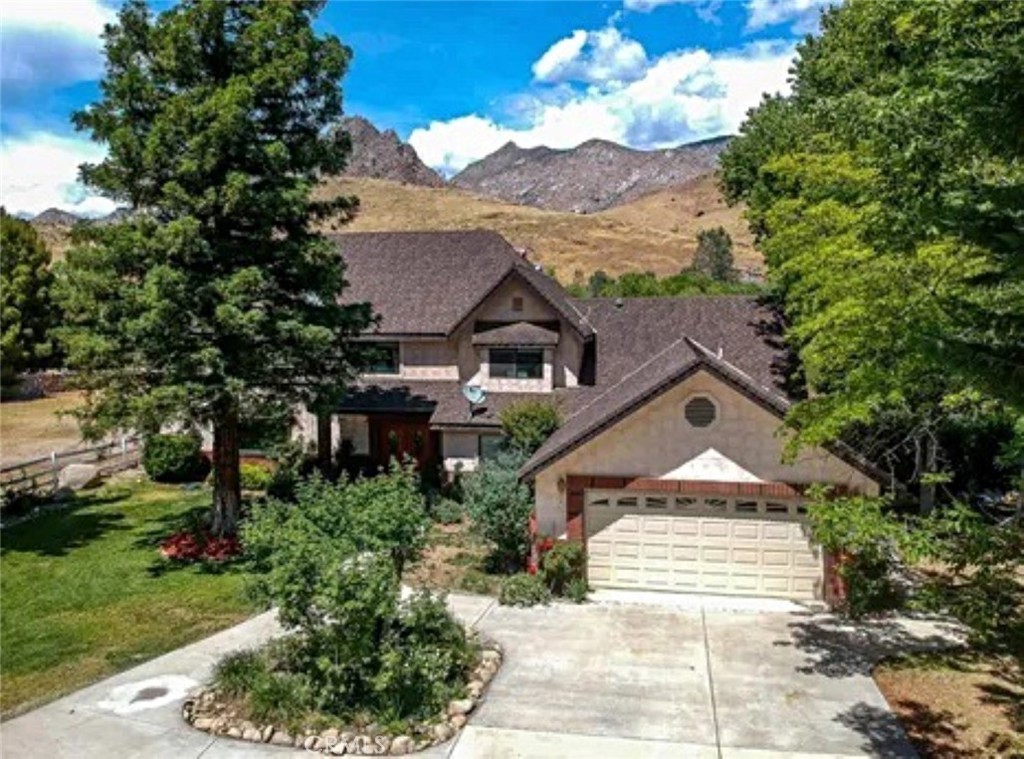132 Rio Del Loma Kernville, CA 93238 - Photo 2 of 33 a front view of a house with a yard
