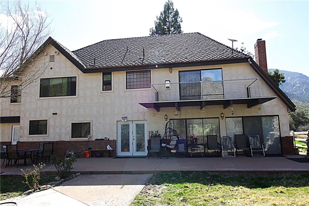 132 Rio Del Loma Kernville, CA 93238 - Photo 22 of 33 a front view of a house with a yard table and chairs