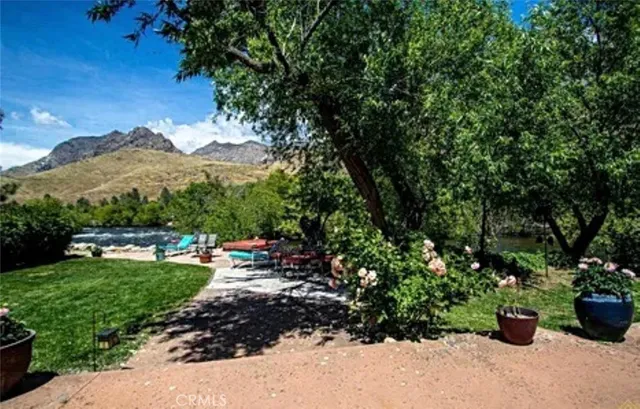 a view of a backyard with sitting area