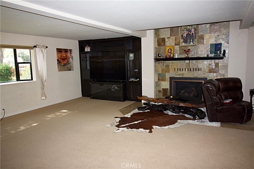 132 Rio Del Loma Kernville, CA 93238 - Photo 10 of 33 a living room with furniture a fireplace and flat screen tv