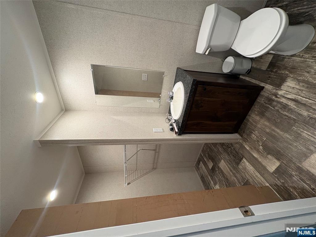 131 Elm Street Lodi, NJ 07644 - Photo 12 of 20 a bathroom with a sink toilet and shower