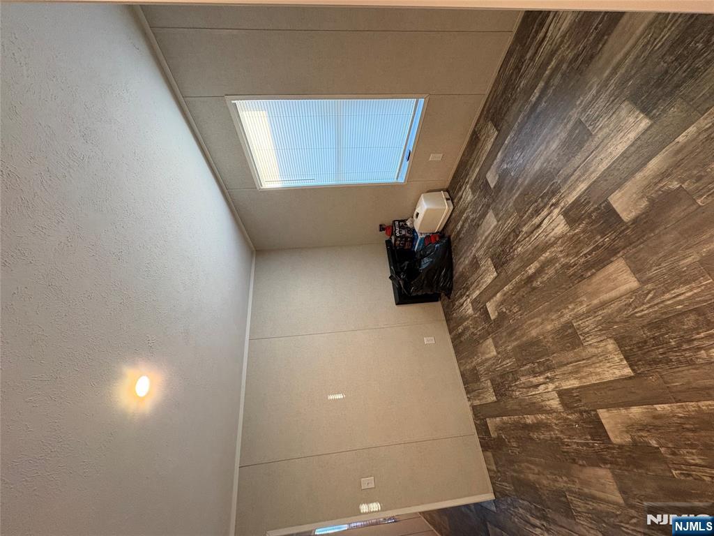 131 Elm Street Lodi, NJ 07644 - Photo 14 of 18 a view of a room with a dishwasher and a window