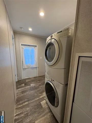 a view of a storage and utility room with washer and dryer
