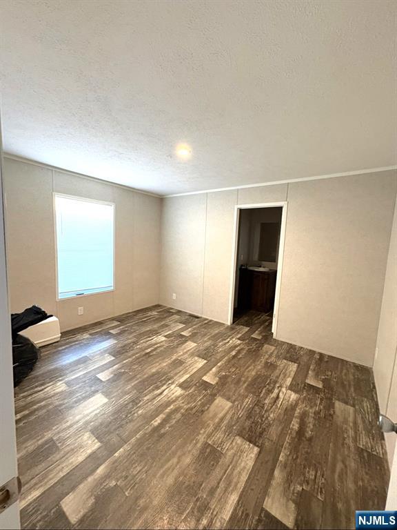 131 Elm Street Lodi, NJ 07644 - Photo 19 of 20 a view of empty room with wooden floor and window