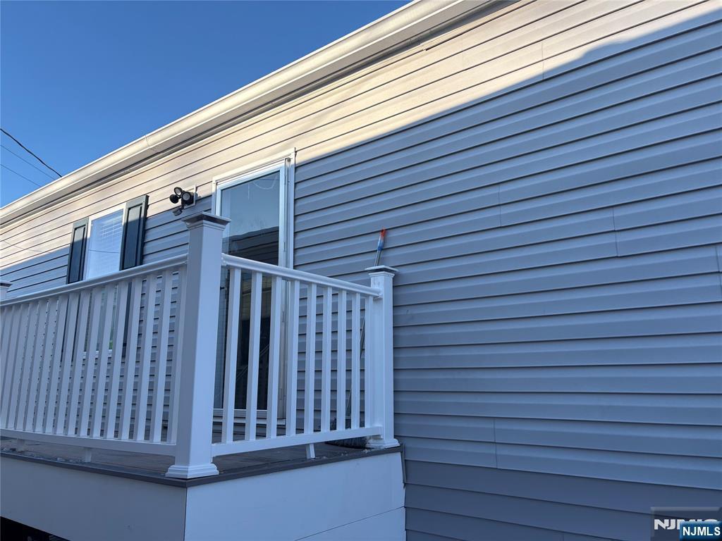 131 Elm Street Lodi, NJ 07644 - Photo 3 of 18 a view of wooden balcony