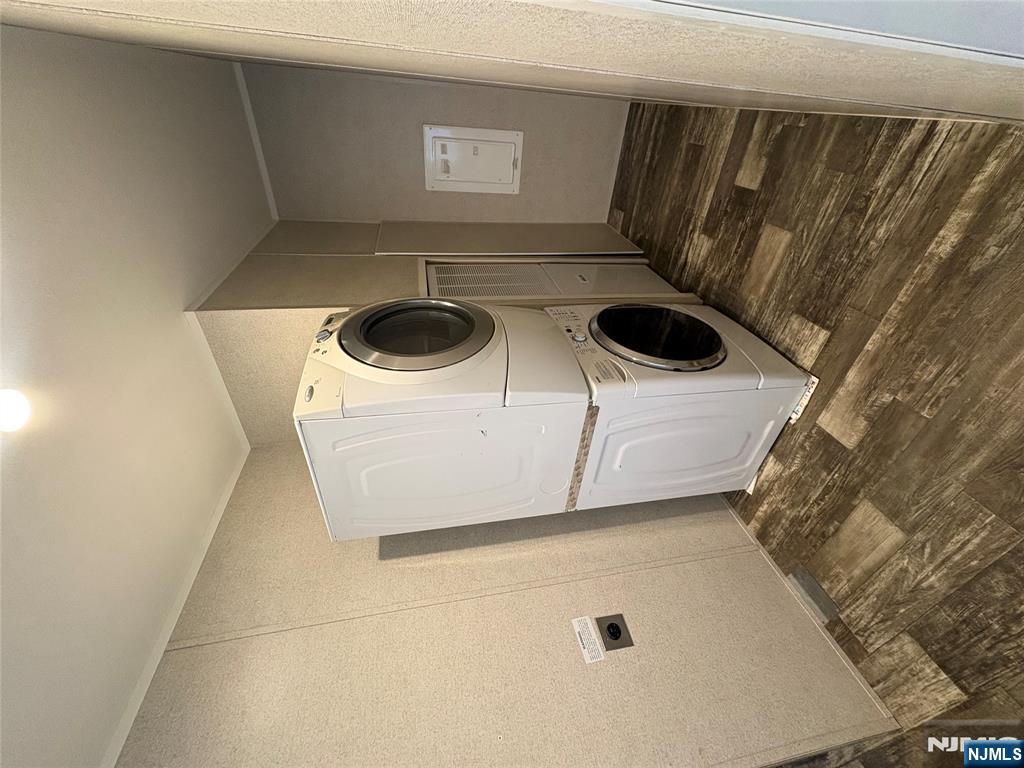 131 Elm Street Lodi, NJ 07644 - Photo 7 of 18 a view of a storage & utility room with washer and dryer