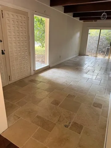 a view of empty room with windows