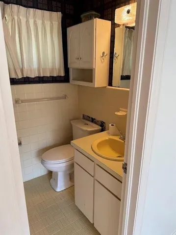 a bathroom with a sink and toilet