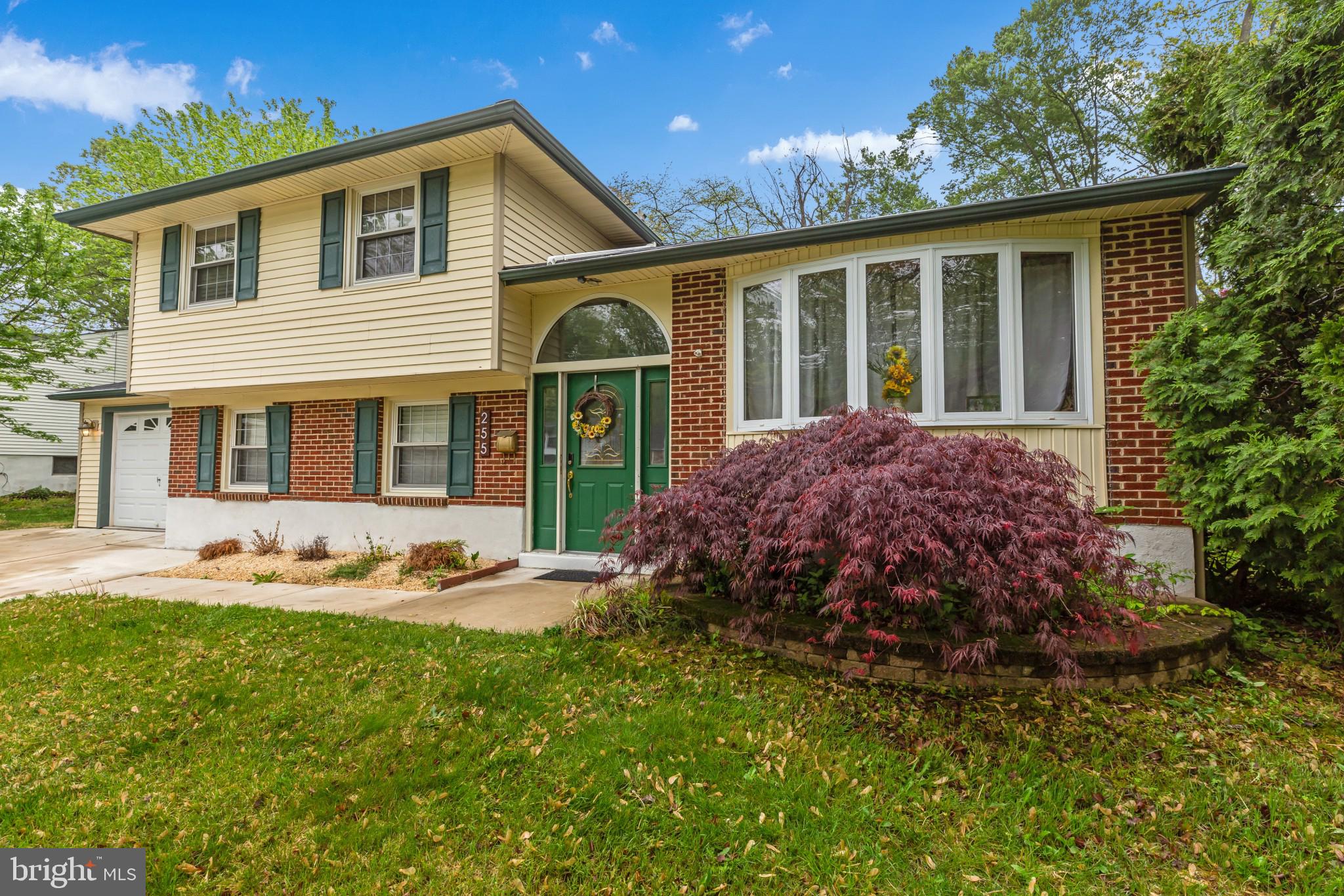 255 Winding Way Road Stratford, NJ 08084 - Photo 2 of 31 a front view of a house with garden and porch