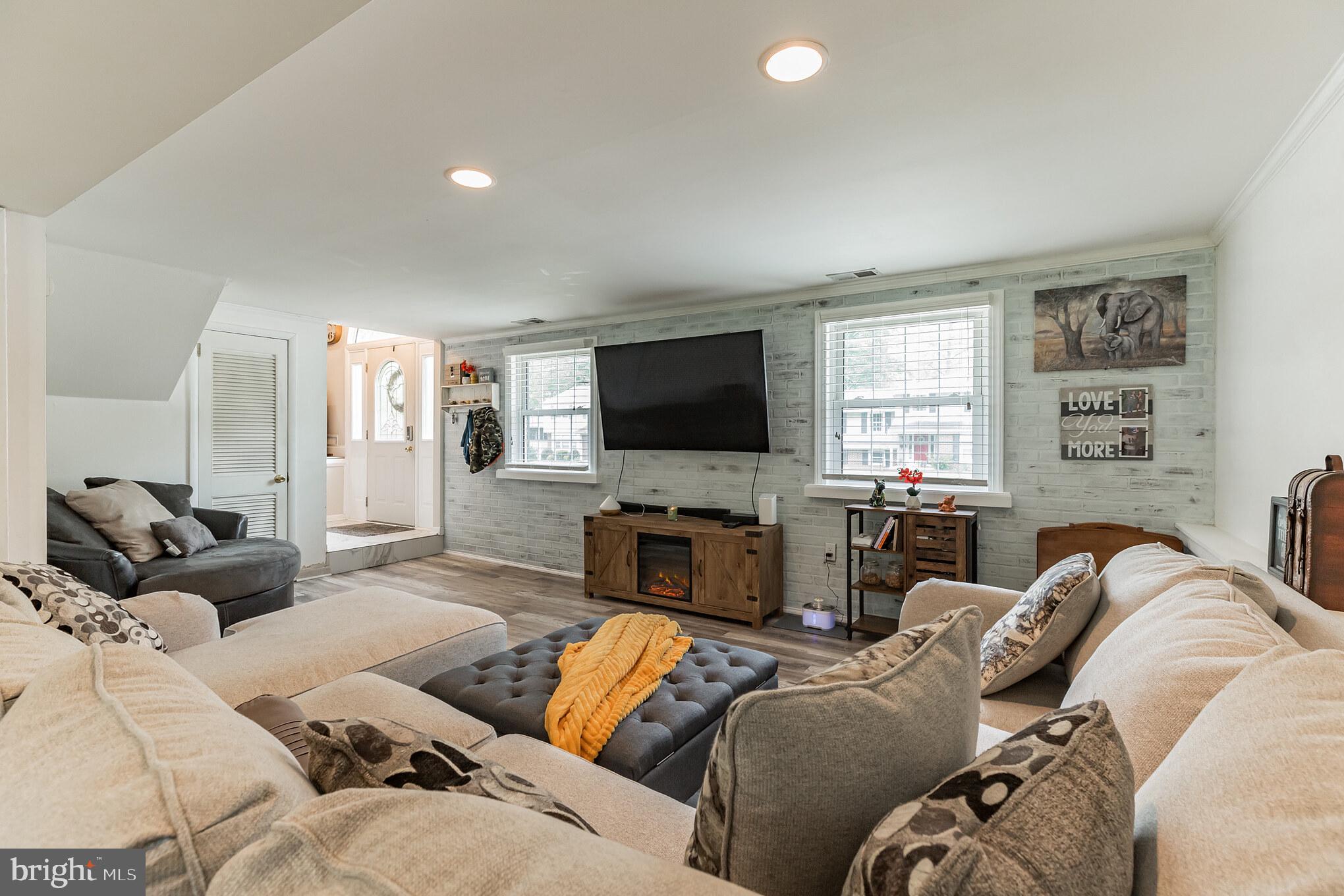 255 Winding Way Road Stratford, NJ 08084 - Photo 22 of 31 a living room with furniture and a flat screen tv