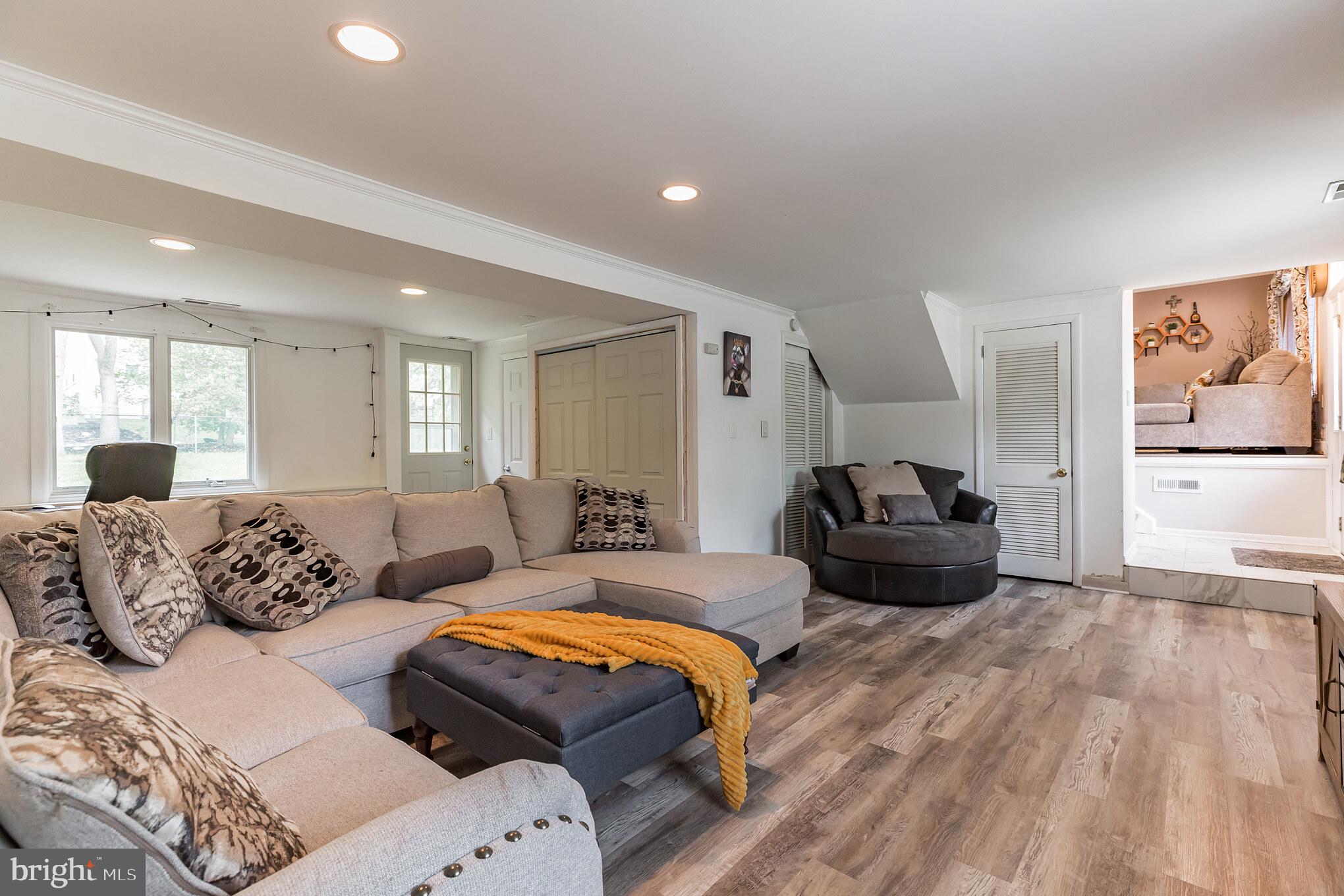 255 Winding Way Road Stratford, NJ 08084 - Photo 24 of 31 a spacious bedroom with a bed and wooden floor
