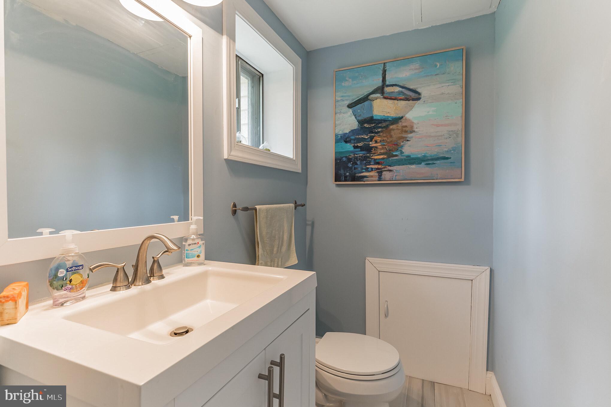 255 Winding Way Road Stratford, NJ 08084 - Photo 25 of 31 a bathroom with a sink vanity and toilet