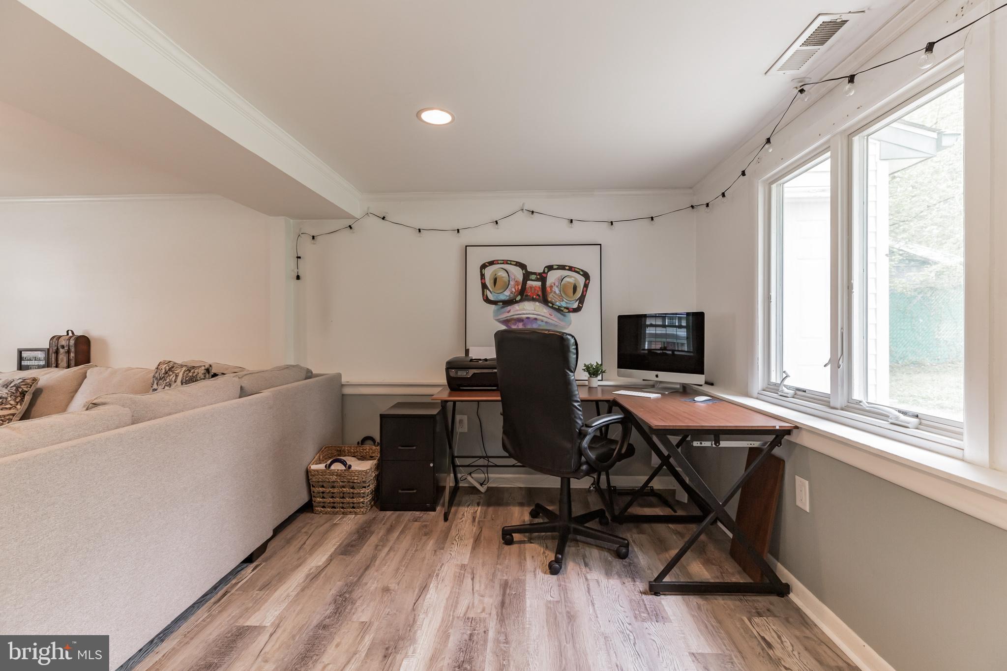 255 Winding Way Road Stratford, NJ 08084 - Photo 26 of 31 a view of a workspace with furniture and a window