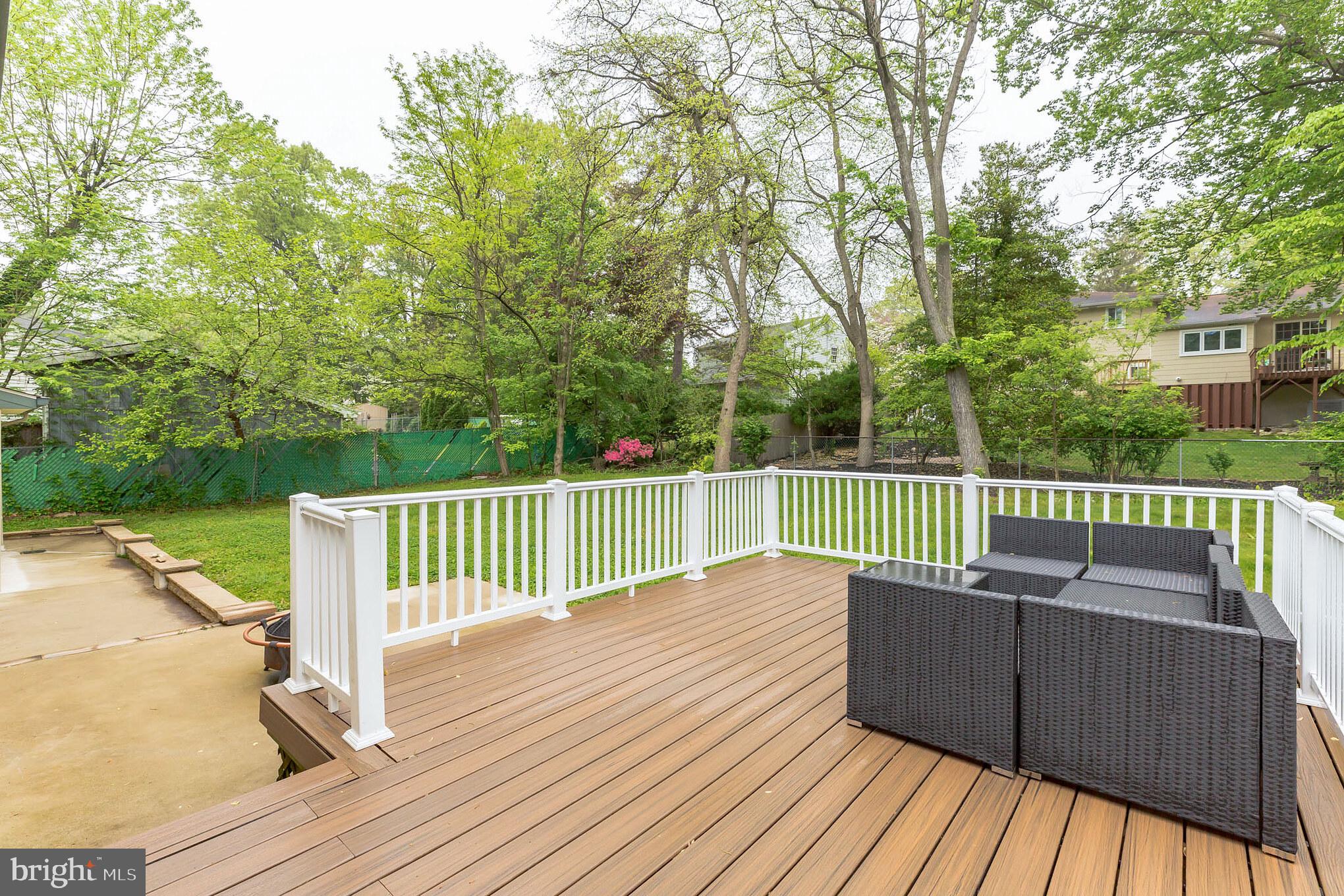 255 Winding Way Road Stratford, NJ 08084 - Photo 27 of 31 a view of deck with a large trees and wooden fence