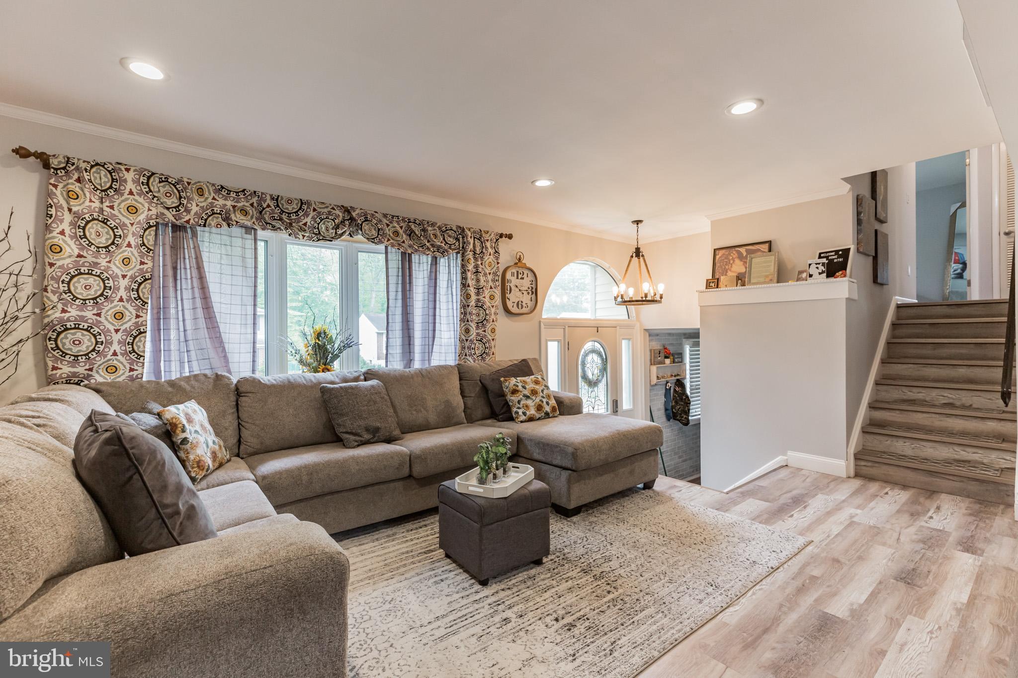 255 Winding Way Road Stratford, NJ 08084 - Photo 5 of 31 a living room with furniture and a large window