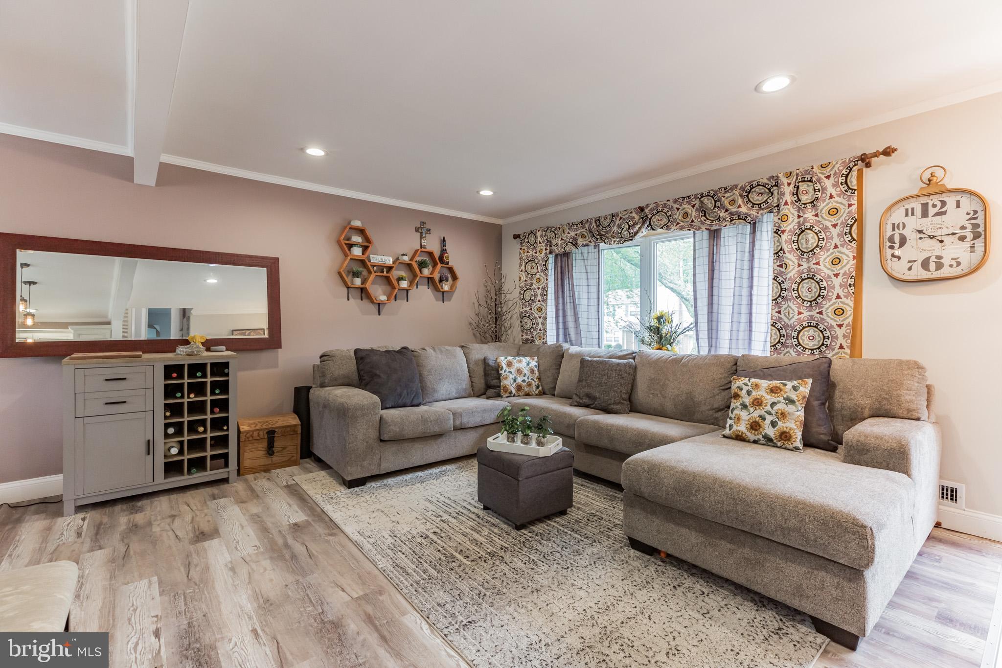 255 Winding Way Road Stratford, NJ 08084 - Photo 6 of 31 a living room with furniture and a flat screen tv