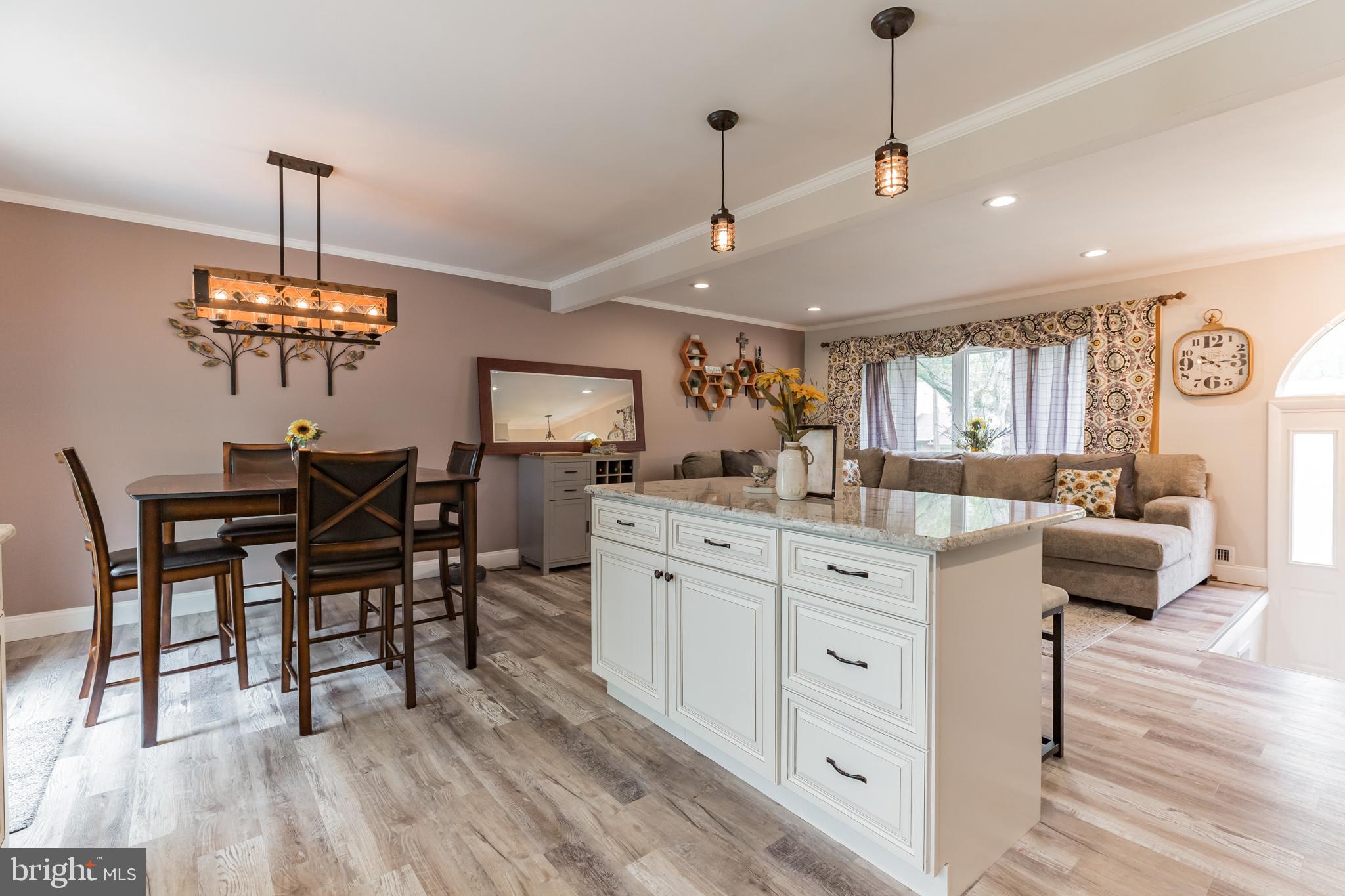 255 Winding Way Road Stratford, NJ 08084 - Photo 7 of 31 a view of a dining room with furniture wooden floor and chandelier