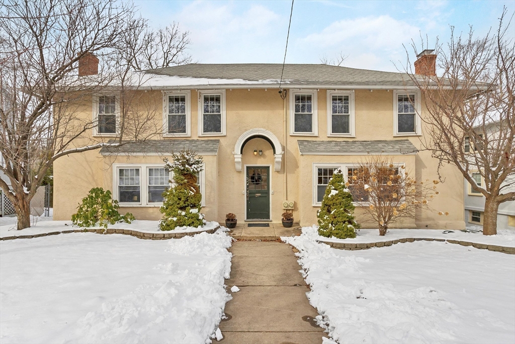 a front view of a house with a yard