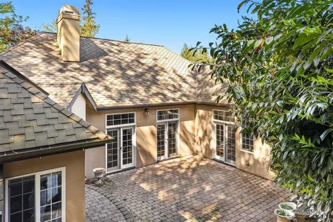 a front view of a house with large windows